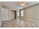 Bright bedroom with mirrored closet and wood-look flooring at 6725 Carrera Dr, Las Vegas, NV 89103