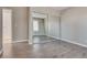 Bedroom with mirrored closet and wood-look flooring at 6725 Carrera Dr, Las Vegas, NV 89103