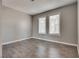 Well-lit bedroom featuring wood-look floors at 6725 Carrera Dr, Las Vegas, NV 89103