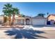 Single-story house with a two-car garage and landscaped front yard at 6725 Carrera Dr, Las Vegas, NV 89103