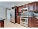 Modern kitchen with stainless steel appliances and granite counters at 6725 Carrera Dr, Las Vegas, NV 89103