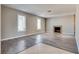 Spacious living room with fireplace and wood-look flooring at 6725 Carrera Dr, Las Vegas, NV 89103