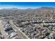 Aerial view of a residential neighborhood with houses and mountain views at 707 Cottonwood Hill Pl, Henderson, NV 89011