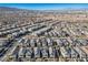 Aerial view of a community with many houses and mountain views at 707 Cottonwood Hill Pl, Henderson, NV 89011