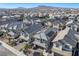 Aerial view of a neighborhood with houses and mountain views at 707 Cottonwood Hill Pl, Henderson, NV 89011