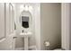 Clean and updated half bathroom with pedestal sink at 707 Cottonwood Hill Pl, Henderson, NV 89011