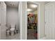 Full bathroom with toilet and access to a large closet at 707 Cottonwood Hill Pl, Henderson, NV 89011