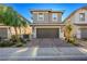 Two-story house with a two-car garage and landscaped front yard at 707 Cottonwood Hill Pl, Henderson, NV 89011