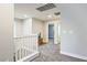 Bright hallway with a white railing and access to multiple rooms at 707 Cottonwood Hill Pl, Henderson, NV 89011