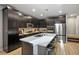 Modern kitchen with stainless steel appliances and island at 707 Cottonwood Hill Pl, Henderson, NV 89011