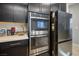 Modern kitchen with stainless steel double oven and refrigerator at 707 Cottonwood Hill Pl, Henderson, NV 89011