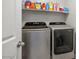 Laundry room with modern washer and dryer, offering convenience and efficiency at 707 Cottonwood Hill Pl, Henderson, NV 89011