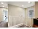 Upstairs hallway with a view to a bedroom and staircase at 707 Cottonwood Hill Pl, Henderson, NV 89011