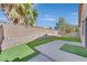 Artificial turf backyard with raised garden beds and patio at 7132 Junction Village Ave, Las Vegas, NV 89129