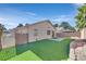 Large backyard with artificial turf and a spacious patio at 7132 Junction Village Ave, Las Vegas, NV 89129