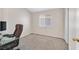 Cozy bedroom with carpeted floors and a desk area at 7132 Junction Village Ave, Las Vegas, NV 89129