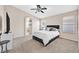 Spacious bedroom with carpeted floors and ceiling fan at 7132 Junction Village Ave, Las Vegas, NV 89129