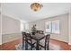 Bright dining room featuring hardwood floors and large windows at 7132 Junction Village Ave, Las Vegas, NV 89129