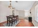 Well lit dining area with hardwood floors and chandelier at 7132 Junction Village Ave, Las Vegas, NV 89129