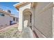 Inviting front entryway with arched doorway and walkway at 7132 Junction Village Ave, Las Vegas, NV 89129