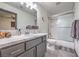 Modern bathroom with gray vanity, subway tile, and bathtub at 7163 Brassica Ct, Las Vegas, NV 89148