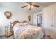 Bright bedroom with ceiling fan and en-suite bathroom access at 7163 Brassica Ct, Las Vegas, NV 89148