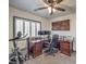 Home office with built-in desk and exercise equipment at 7163 Brassica Ct, Las Vegas, NV 89148