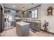 Modern kitchen with gray cabinets, stainless steel appliances, and white countertops at 7163 Brassica Ct, Las Vegas, NV 89148