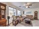 Relaxing living room with large windows and fireplace at 7163 Brassica Ct, Las Vegas, NV 89148