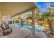 Relaxing covered patio overlooking the pool at 7163 Brassica Ct, Las Vegas, NV 89148