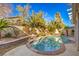 Inviting kidney-shaped pool with surrounding landscaping at 7163 Brassica Ct, Las Vegas, NV 89148