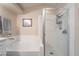 Bathroom with a shower and a separate bathtub at 7925 Settlers Ridge Ln, Las Vegas, NV 89145