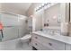 Clean bathroom with updated vanity, large mirror, and shower/tub combo at 7925 Settlers Ridge Ln, Las Vegas, NV 89145