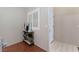 Small entryway with shelving, hardwood floor, and access to other rooms at 7925 Settlers Ridge Ln, Las Vegas, NV 89145