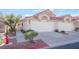 Attractive two-unit stucco home with double garage and mature landscaping at 7925 Settlers Ridge Ln, Las Vegas, NV 89145