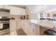 Modern kitchen with white cabinets, stainless steel appliances, and quartz countertops at 7925 Settlers Ridge Ln, Las Vegas, NV 89145