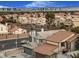 Aerial view of houses with a city skyline in the background at 8101 Spur Ct, Las Vegas, NV 89145