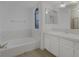 Bathroom with bathtub, shower and white cabinets at 8101 Spur Ct, Las Vegas, NV 89145