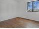 Bedroom featuring wood-look flooring and a window with street view at 8101 Spur Ct, Las Vegas, NV 89145