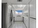 White kitchen with stainless steel appliances at 8101 Spur Ct, Las Vegas, NV 89145