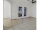 Bright living room with tile floors and sliding doors at 8101 Spur Ct, Las Vegas, NV 89145