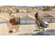 Two-car garage home with a front yard, aerial view at 861 Zinnia Cir, Henderson, NV 89015