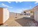 Large backyard with covered patio, shed, and gravel landscaping at 861 Zinnia Cir, Henderson, NV 89015