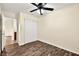 Bedroom with ceiling fan, sliding door closet, and wood-look floors at 861 Zinnia Cir, Henderson, NV 89015