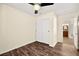 Bedroom with ceiling fan, sliding door closet, and bathroom access at 861 Zinnia Cir, Henderson, NV 89015