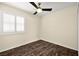 Well lit bedroom with ceiling fan and wood-look floors at 861 Zinnia Cir, Henderson, NV 89015