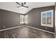 Gray walls and wood-look floors in this bright bedroom at 861 Zinnia Cir, Henderson, NV 89015