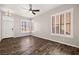 Living room with wood-look floors and ceiling fan at 861 Zinnia Cir, Henderson, NV 89015