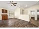 Spacious living room featuring wood-look floors and built-in cabinetry at 861 Zinnia Cir, Henderson, NV 89015