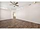 Bright living room with wood-look floors and ceiling fan at 861 Zinnia Cir, Henderson, NV 89015